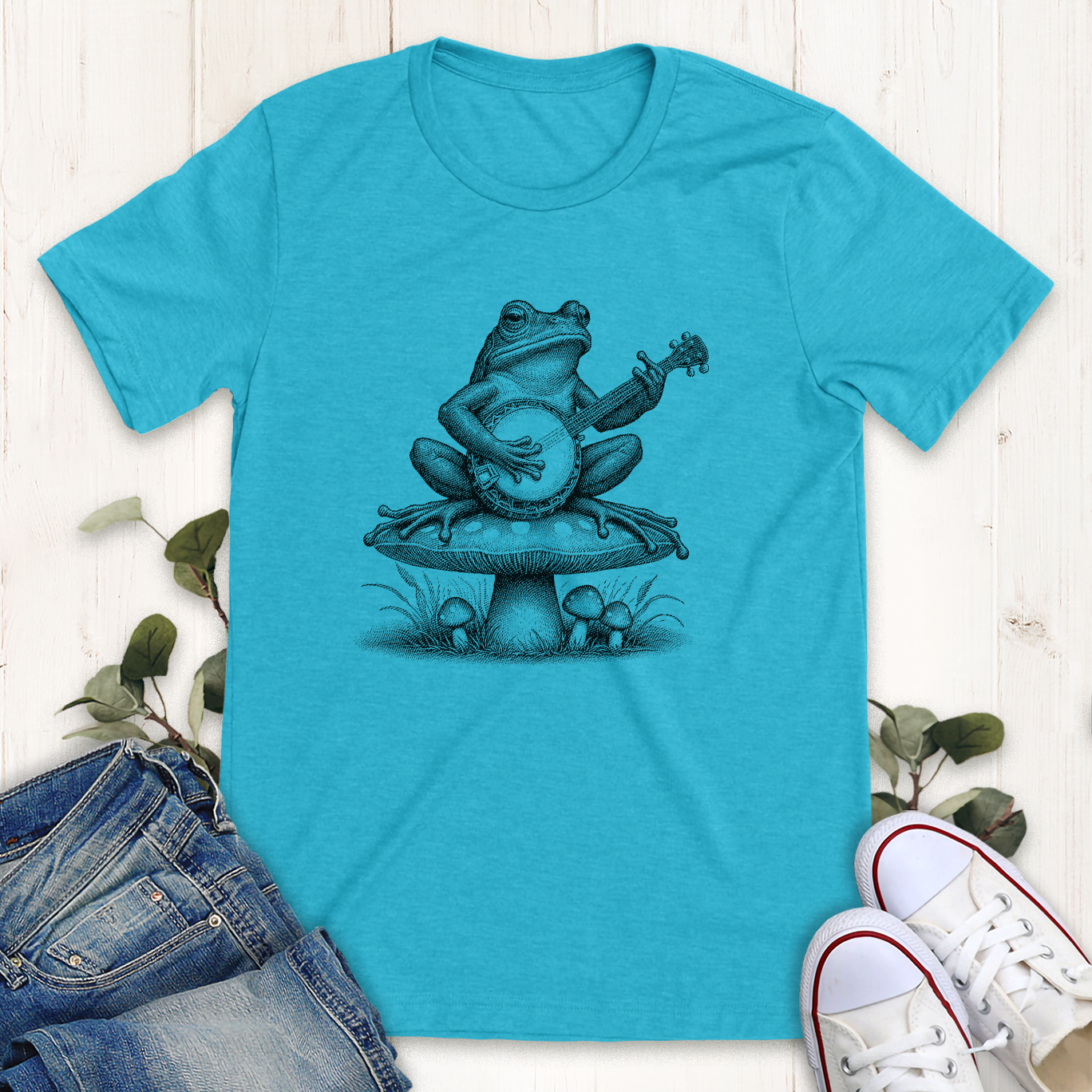 Heather aqua Banjo frog on a mushroom graphic t-shirt by Thistle and Brass