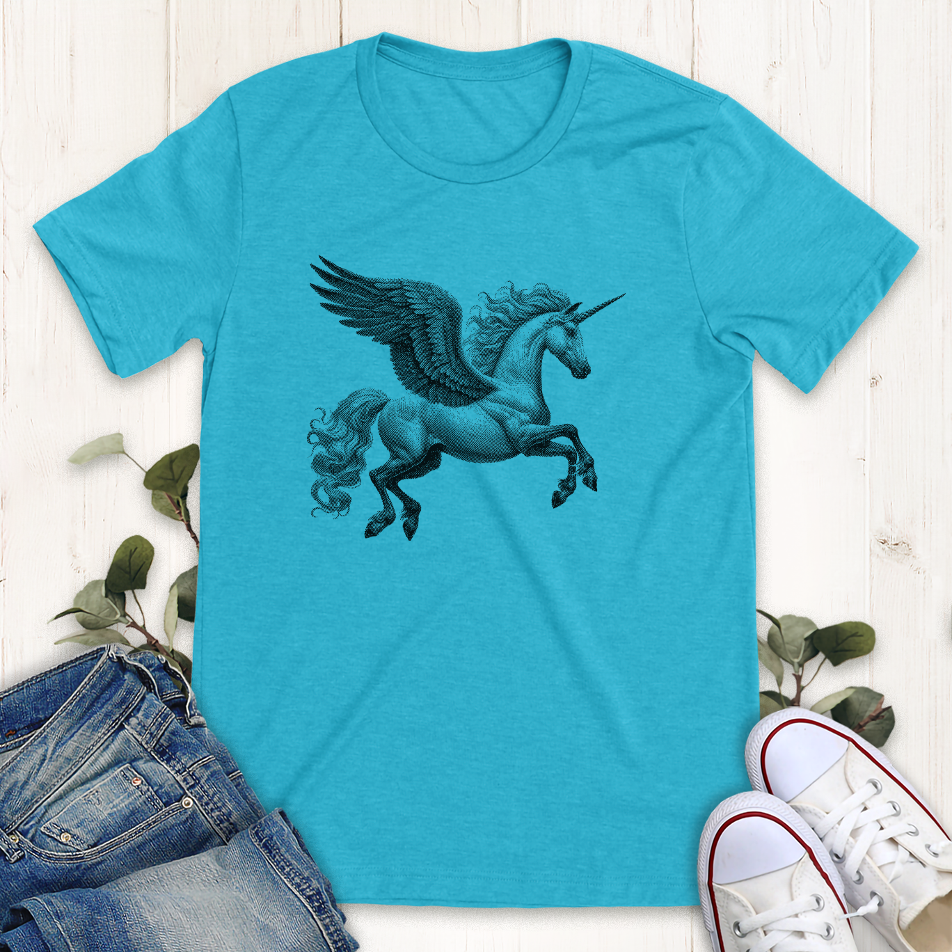 Heather aqua blue color winged unicorn in flight  graphic t-shirt by Thistle and Brass