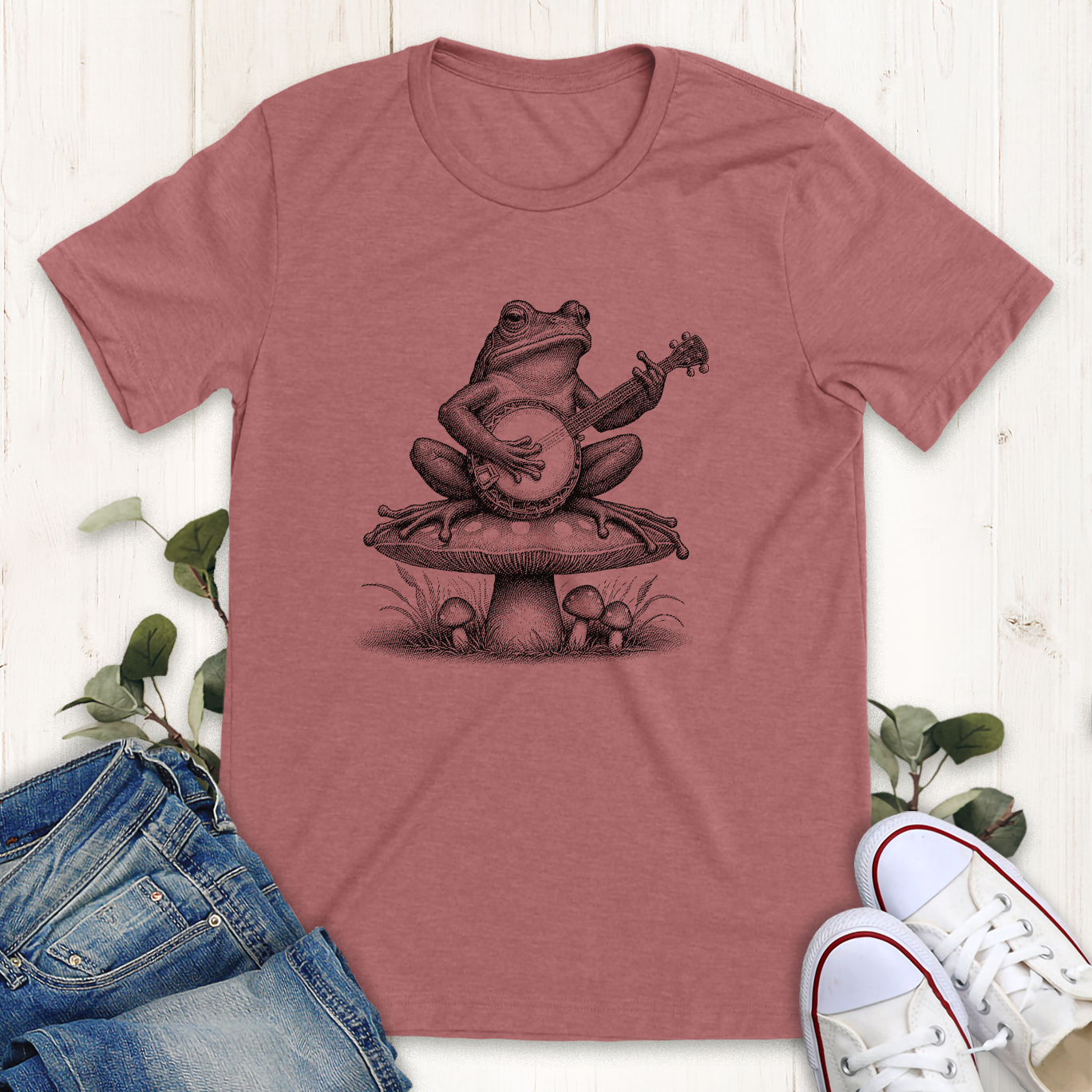 Heather mauve Banjo frog on a mushroom graphic t-shirt by Thistle and Brass