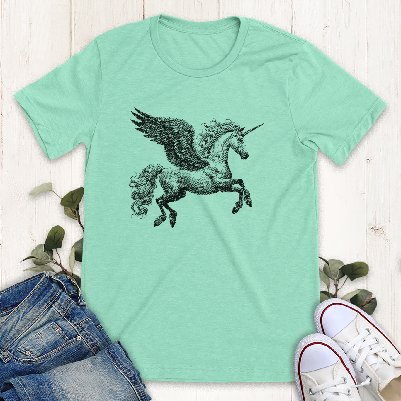 Heather mint color winged unicorn in flight  graphic t-shirt by Thistle and Brass