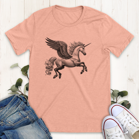 Heather peach color winged unicorn in flight  graphic t-shirt by Thistle and Brass