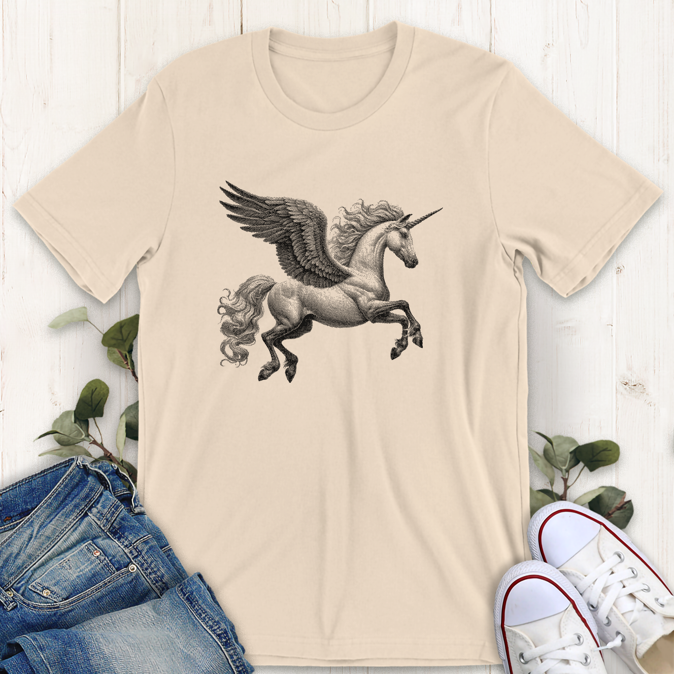 Soft Cream tan color winged unicorn in flight  graphic t-shirt by Thistle and Brass